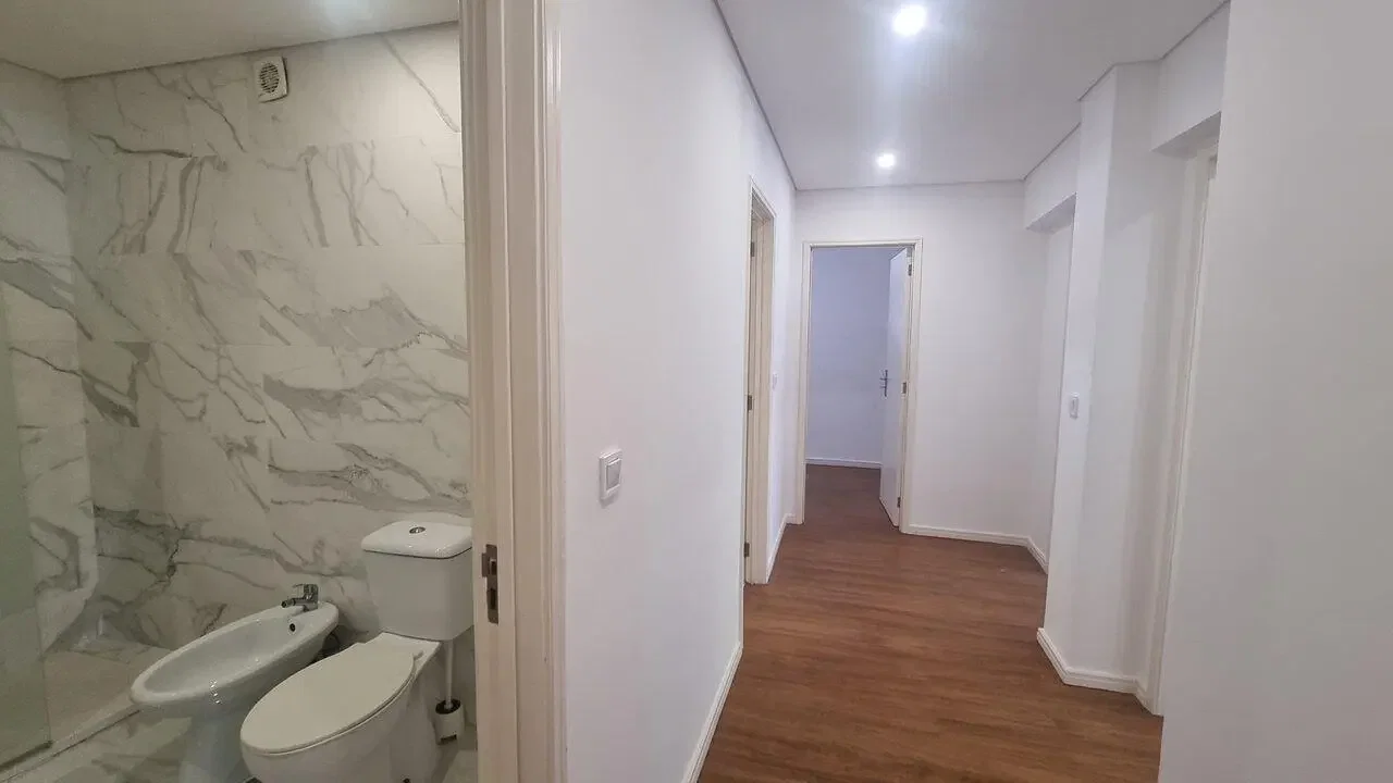 Toilet; tile floor, natural light