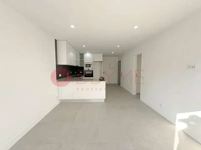 Kitchen; kitchen appliances, tile floor, natural light