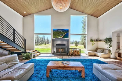 Living room; view, fireplace, natural light, modern style, high ceiling, wood beams