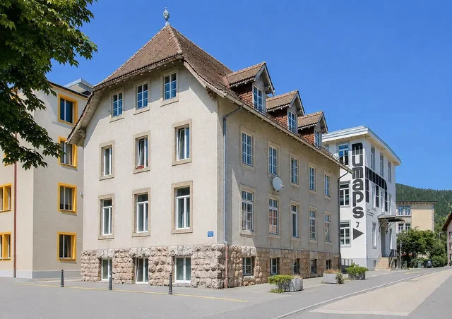 House and surroundings; view