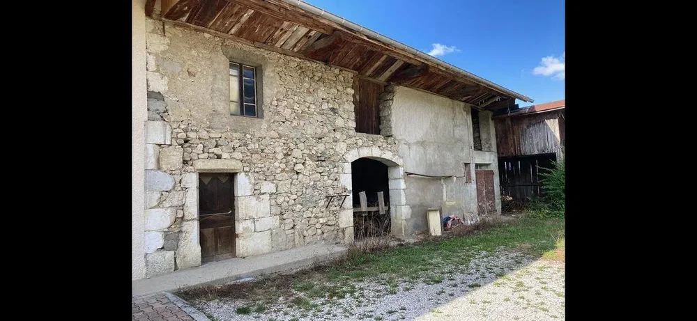 House and surroundings; needs renovation, wood beams