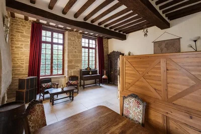 Living room; wood beams, wood floor, natural light, rustic style