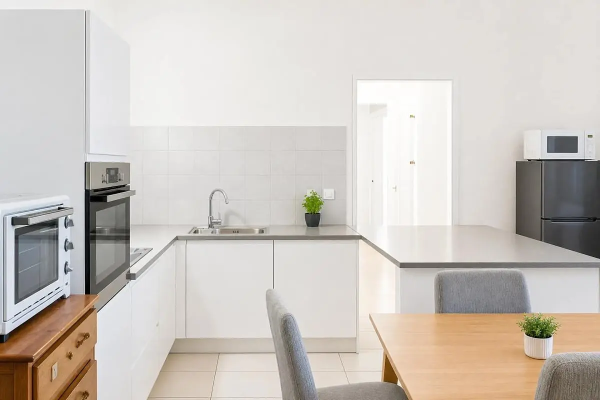 Kitchen; kitchen appliances, tile floor, natural light