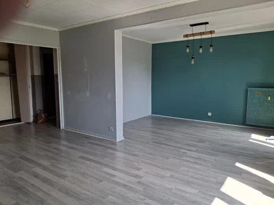 Living room; wood floor, natural light, needs renovation