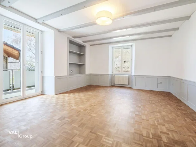 Living room; wood floor, natural light, wood beams