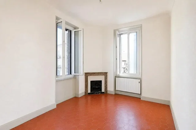Living room; fireplace, tile floor, natural light