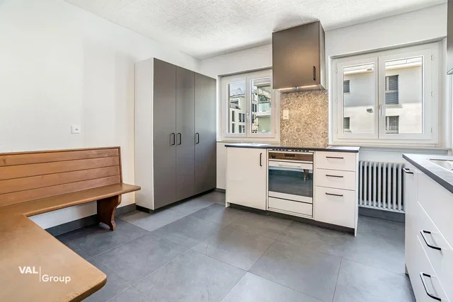 Kitchen; kitchen appliances, tile floor, natural light