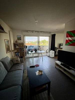 Living room; natural light, tile floor, view