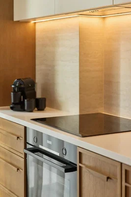 Kitchen; kitchen appliances, wood floor, tile floor, renovated, natural light