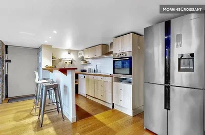 Kitchen; kitchen appliances, wood floor, natural light