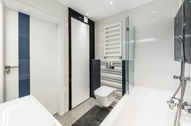 Toilet; tile floor, renovated, natural light