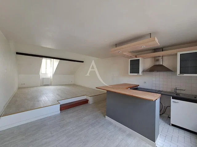 Kitchen; kitchen appliances, wood beams, tile floor, needs renovation