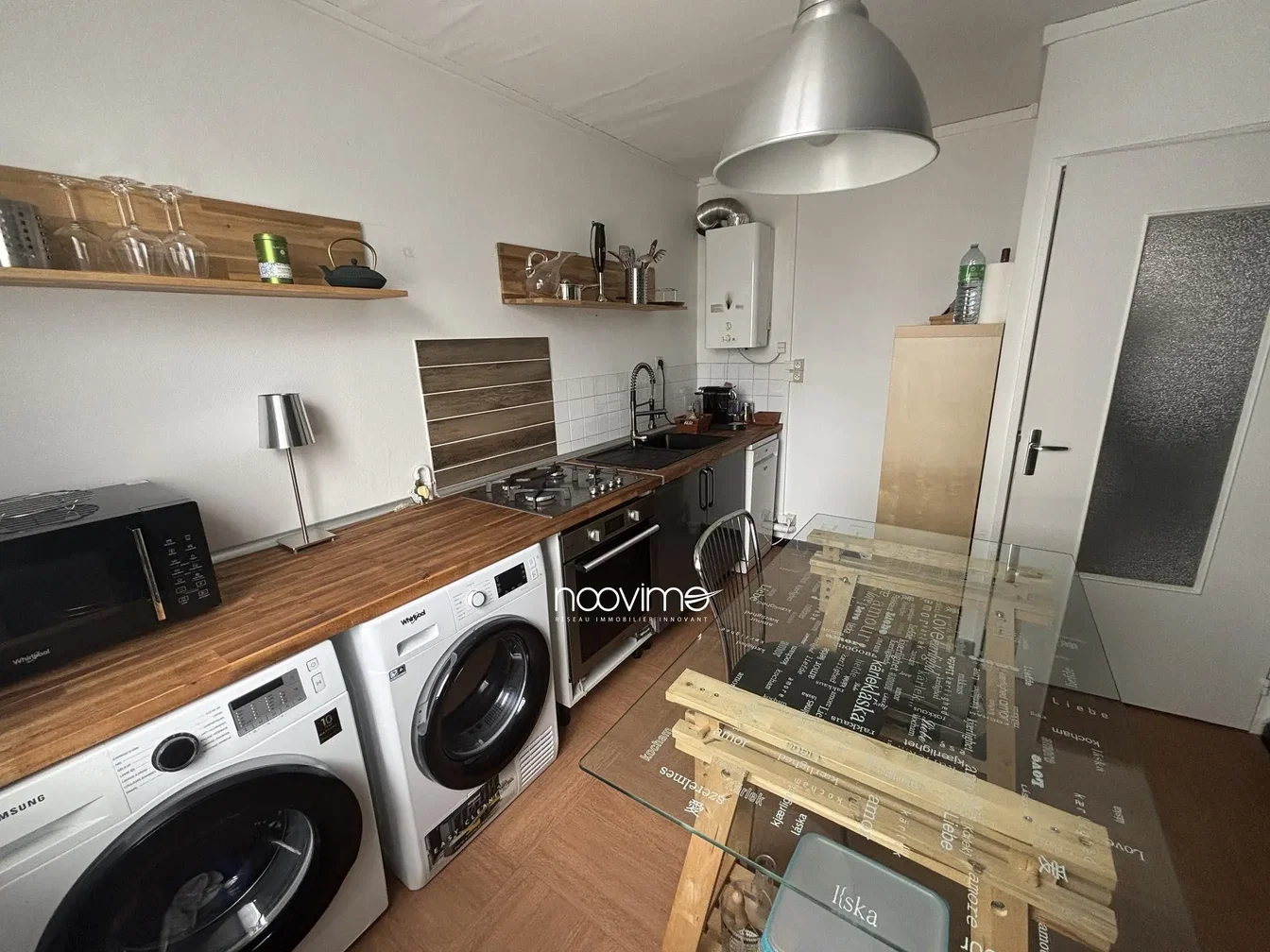 Kitchen; kitchen appliances, wood floor, needs renovation