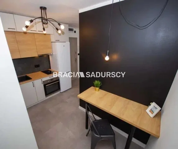 Kitchen; kitchen appliances, tile floor, natural light