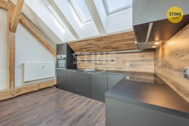 Kitchen; kitchen appliances, wood beams, wood floor, natural light