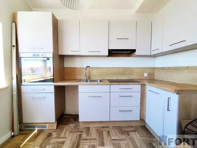 Kitchen; kitchen appliances, wood floor, natural light, renovated