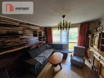 Living room; wood beams, wood floor, natural light, rustic style