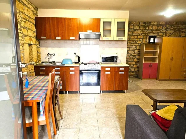 Kitchen; kitchen appliances, tile floor, natural light