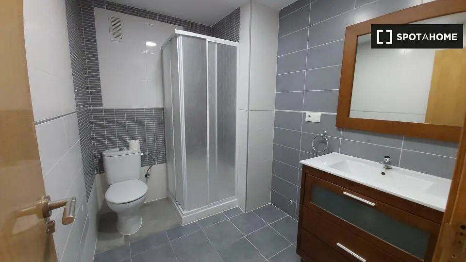 Toilet; tile floor, renovated, natural light