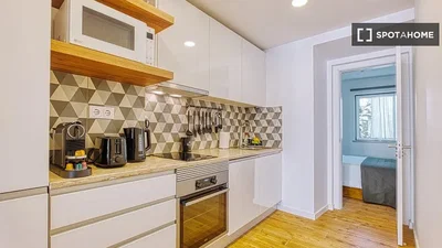 Kitchen; kitchen appliances, wood floor, natural light