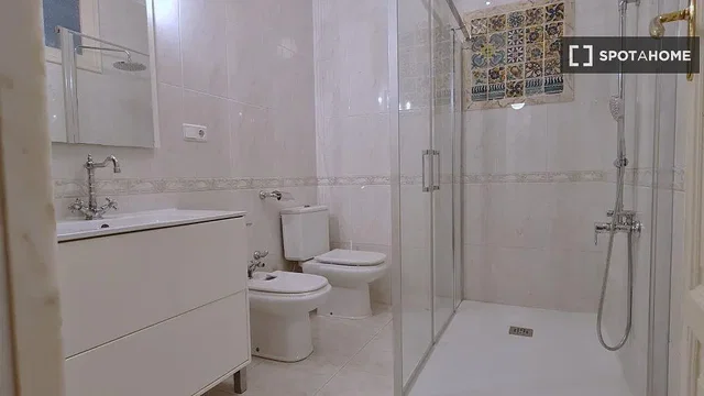 Toilet; tile floor, renovated, natural light