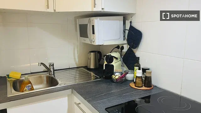 Kitchen; kitchen appliances, tile floor, needs renovation