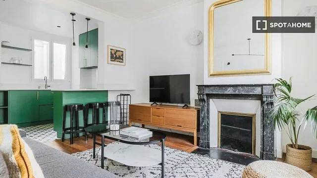 Living room; fireplace, kitchen appliances, natural light, modern style