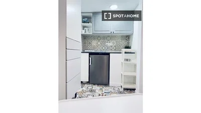 Kitchen; kitchen appliances, tile floor, natural light