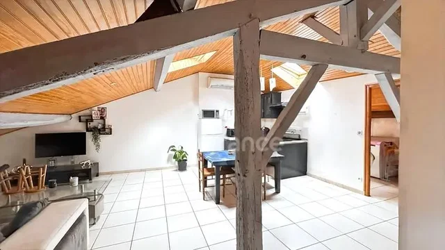 Living room; tile floor, wood beams, natural light