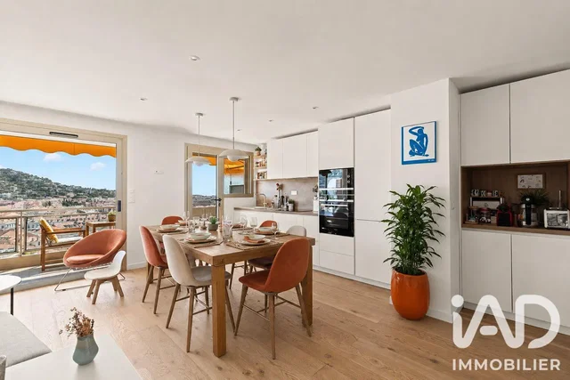 Dining room; view, kitchen appliances, natural light, modern style, wood floor