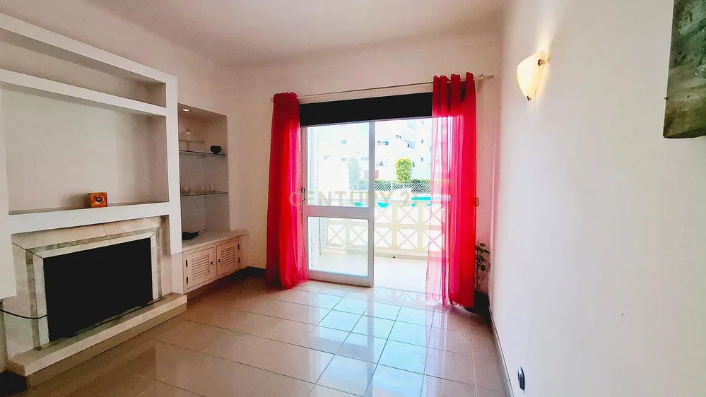 Living room; fireplace, tile floor, natural light