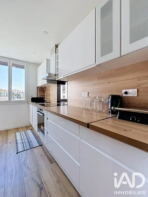Kitchen; kitchen appliances, wood floor, natural light, modern style, renovated