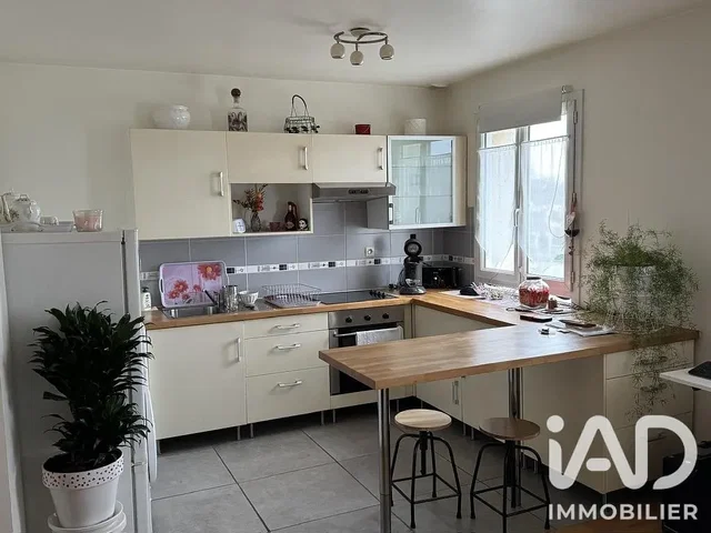 Kitchen; kitchen appliances, tile floor, natural light
