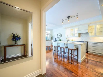 Kitchen; kitchen appliances, wood floor, natural light, modern style