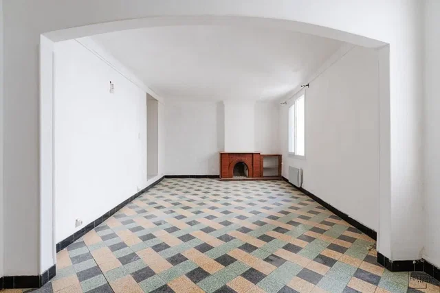Living room; fireplace, tile floor, needs renovation, natural light