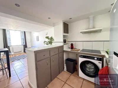 Kitchen; tile floor, kitchen appliances, natural light