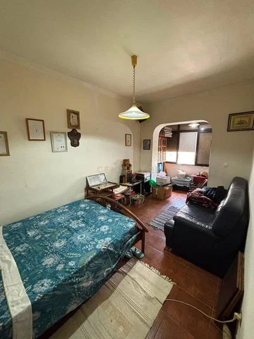 Bedroom; natural light, needs renovation, wood floor