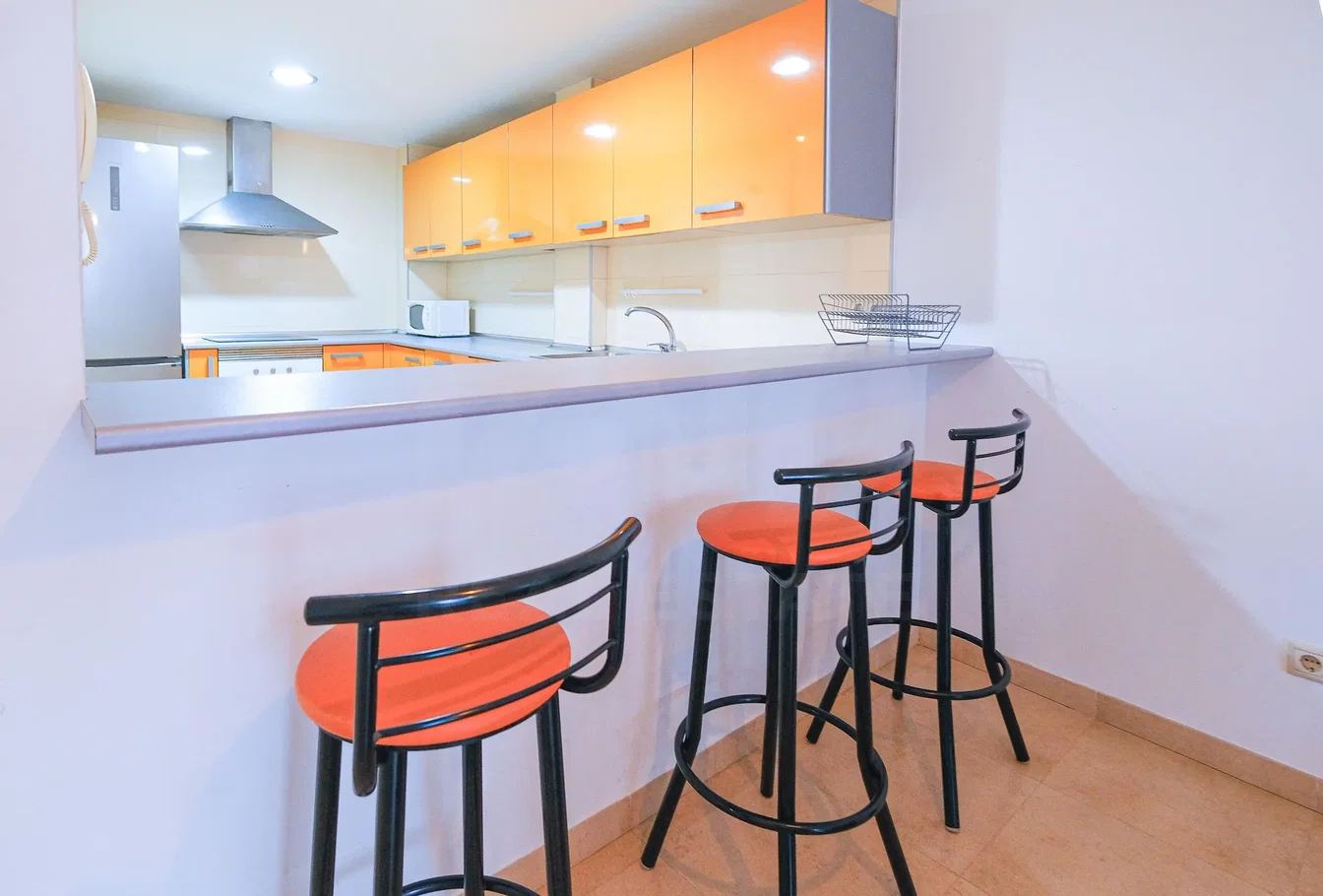 Kitchen; kitchen appliances, natural light, tile floor