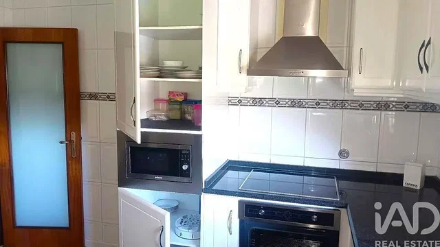 Kitchen; kitchen appliances, tile floor, wood floor