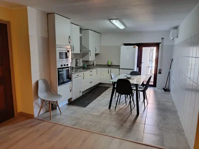 Kitchen; kitchen appliances, tile floor, natural light
