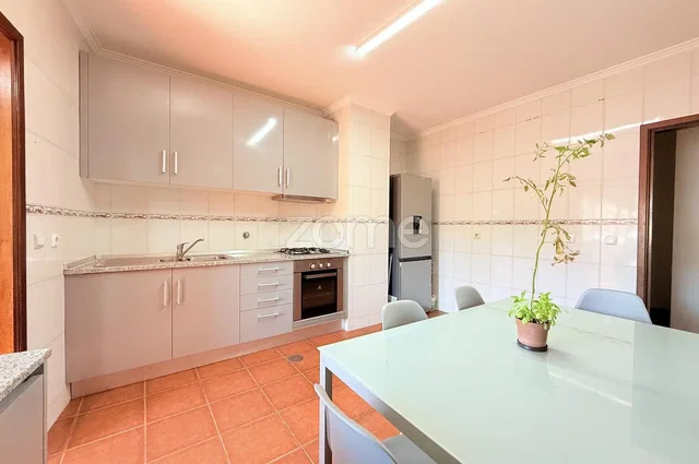 Kitchen; kitchen appliances, tile floor, natural light
