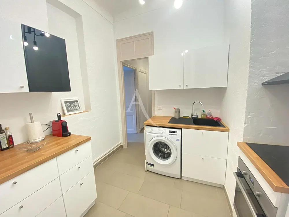 Kitchen; kitchen appliances, tile floor, natural light