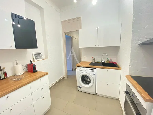 Kitchen; kitchen appliances, tile floor, natural light