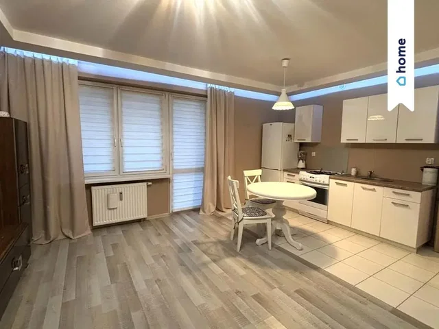 Kitchen; kitchen appliances, wood floor, tile floor, natural light