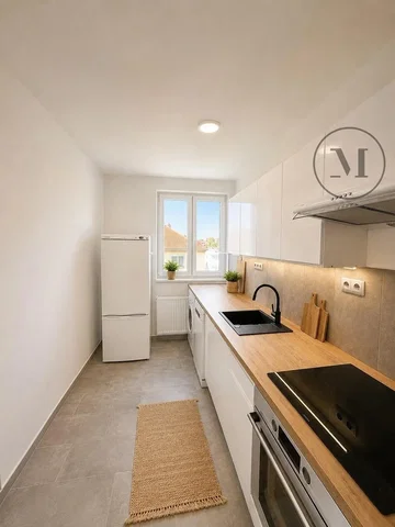 Kitchen; kitchen appliances, tile floor, natural light