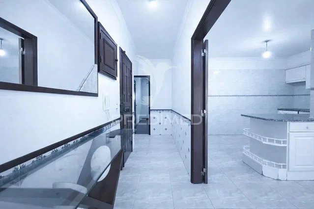 Kitchen; kitchen appliances, tile floor, natural light