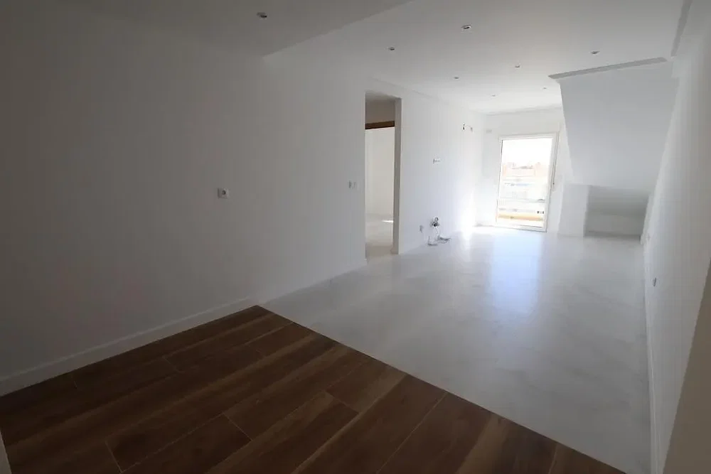 Living room; wood floor, natural light, needs renovation