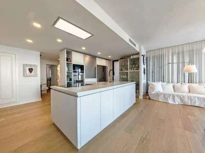 Kitchen; kitchen appliances, wood floor, natural light