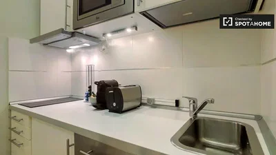 Kitchen; kitchen appliances, tile floor, renovated, natural light