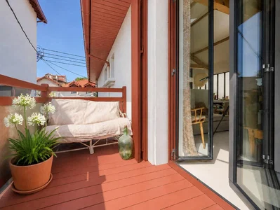Balcony; natural light, wood floor